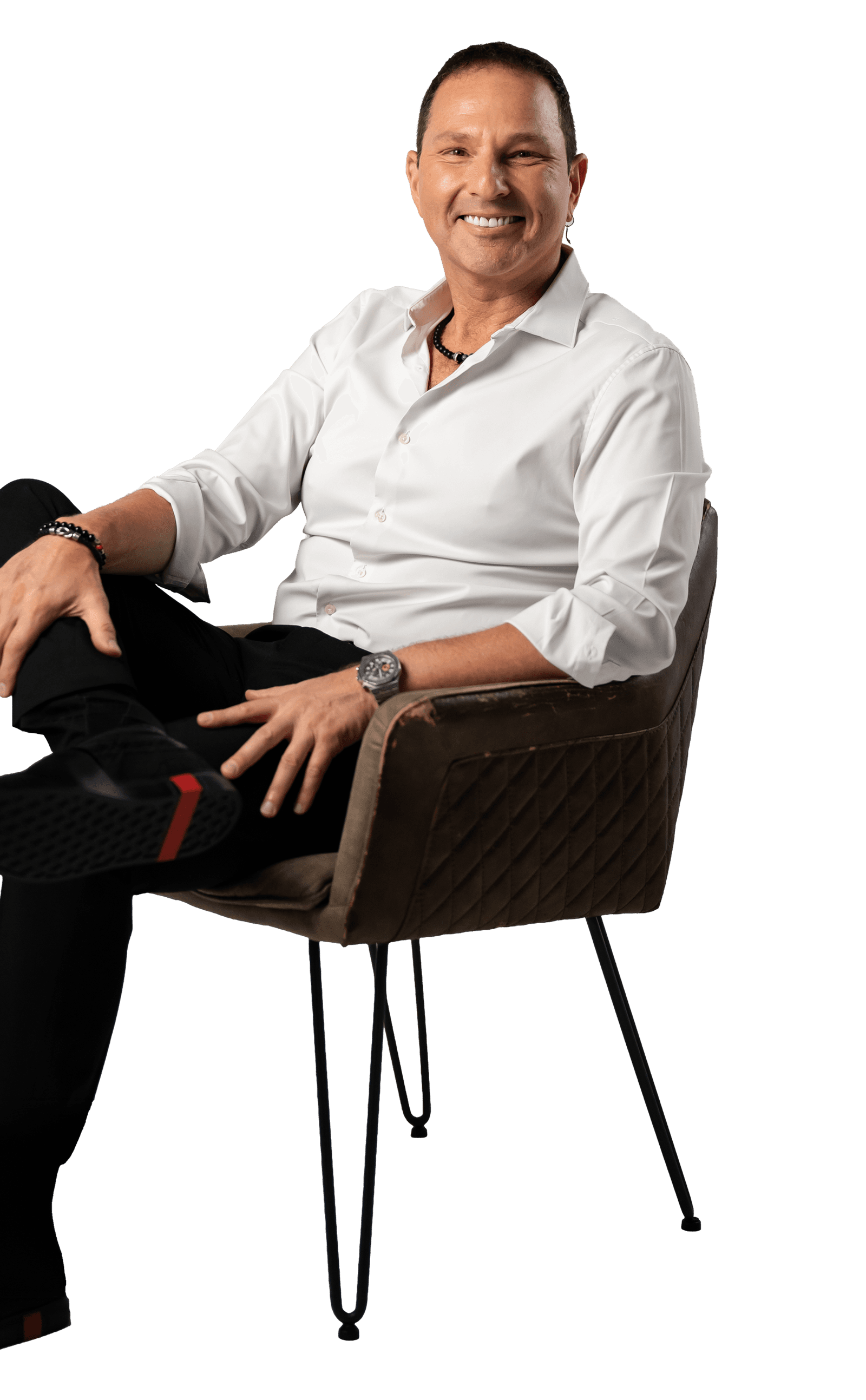 Guy Bavli seated, smiling