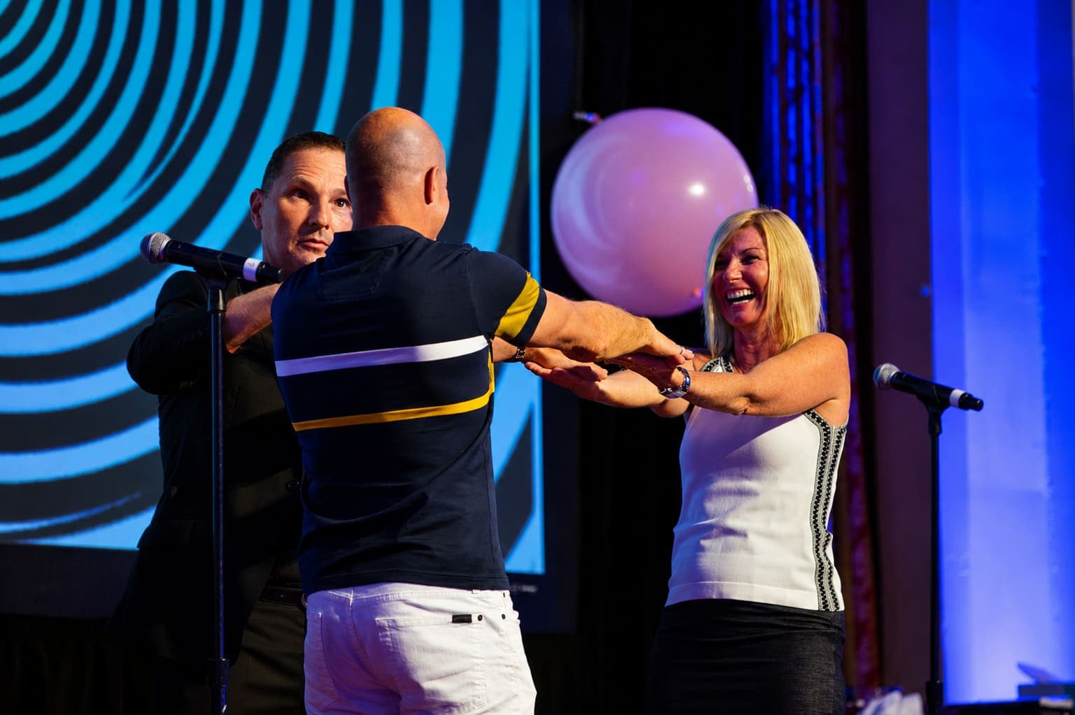 Audience members connecting during a corporate event performance