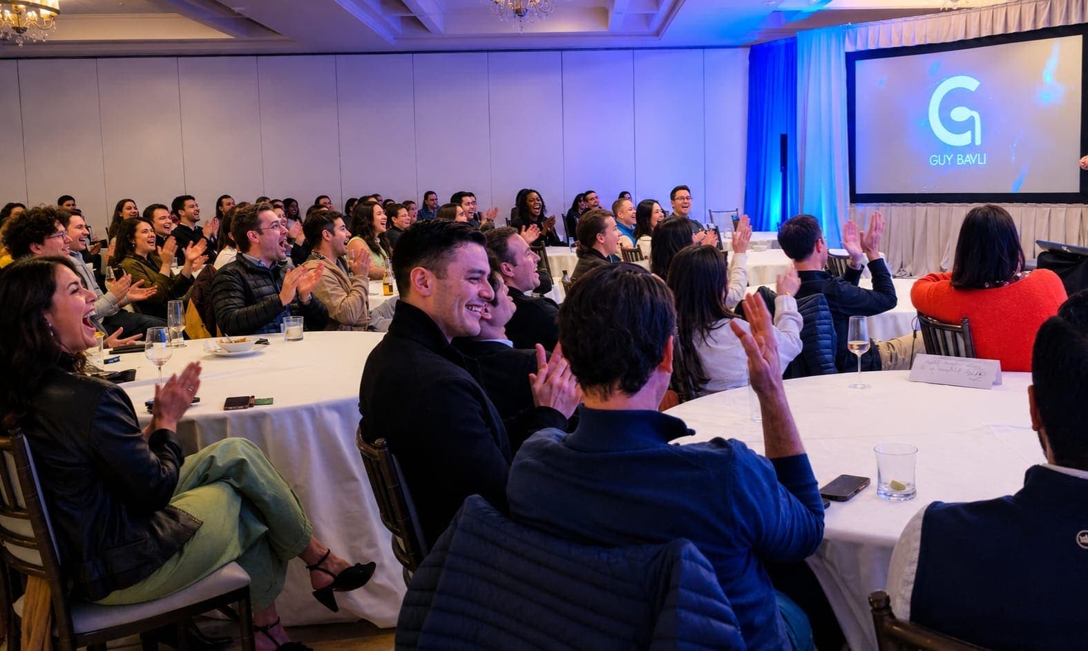 Audience reactions at the Four Seasons corporate event