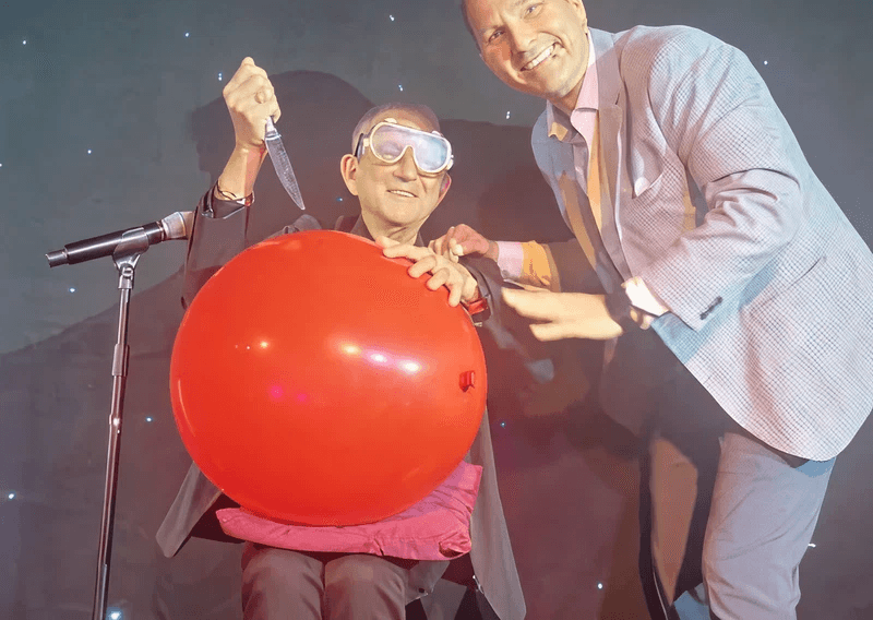 Volunteer with a balloon during a stunt