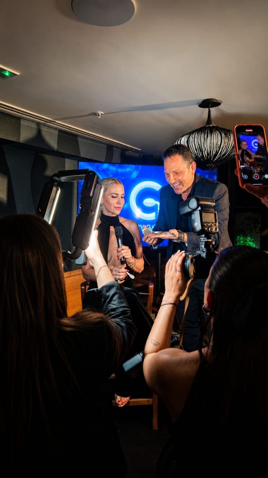 Guy Bavli hosting as emcee at a conference