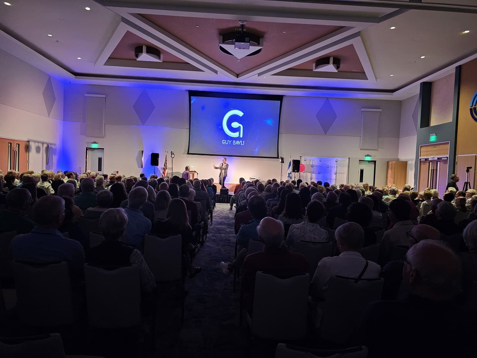Guy Bavli stage performance under blue lights