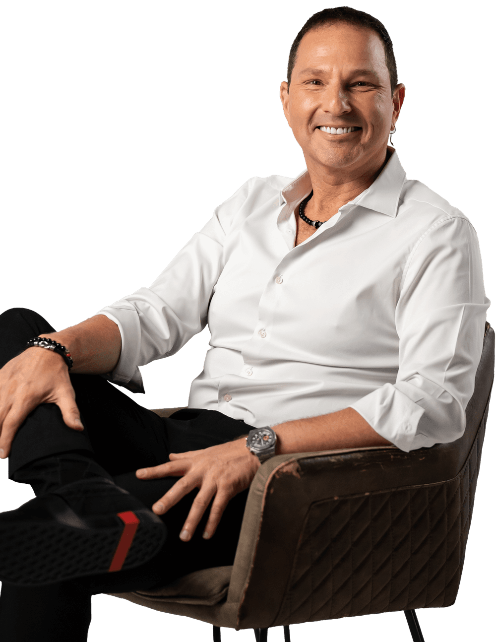 Guy Bavli seated, smiling