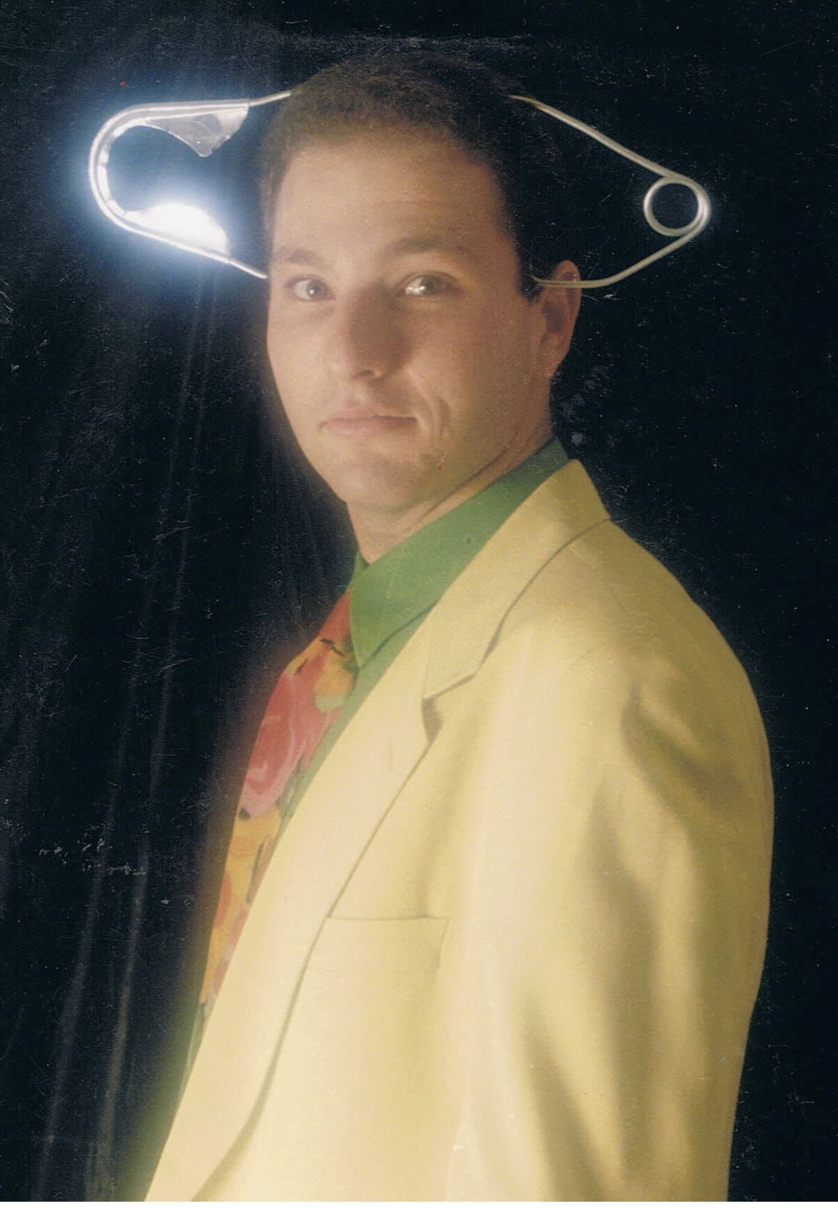 A young Guy Bavli performing with a safety pin illusion