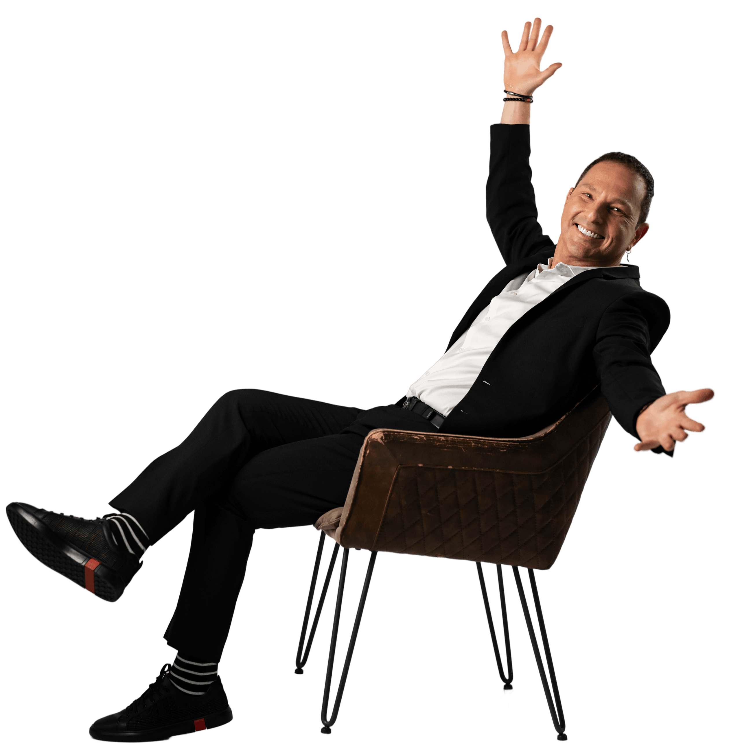 Guy Bavli waving hello from a chair