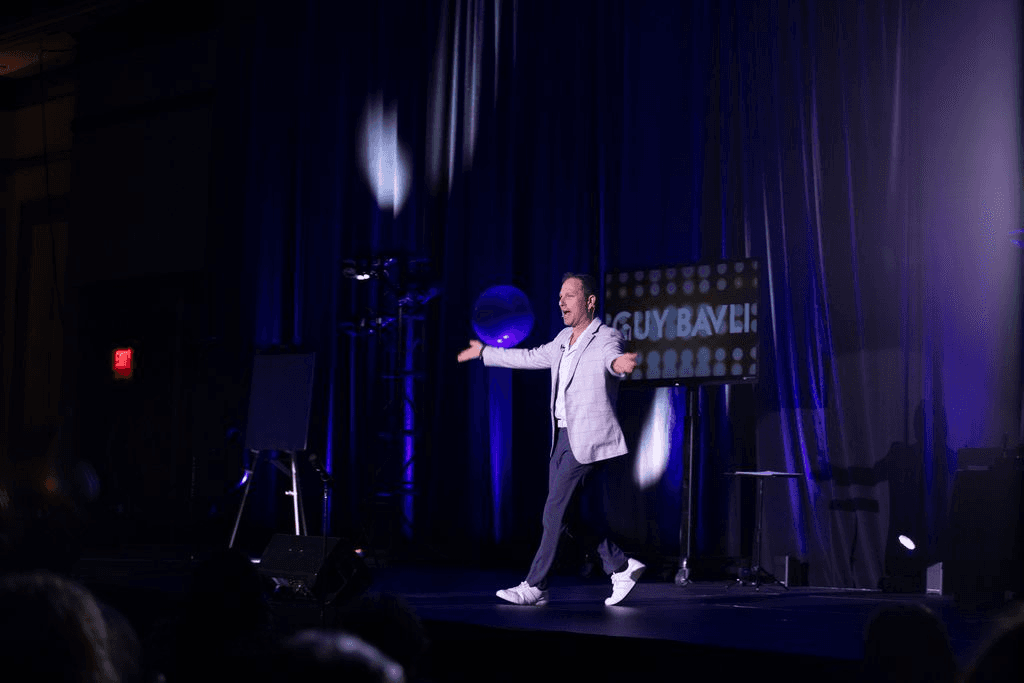 Guy Bavli hosting an awards evening on stage