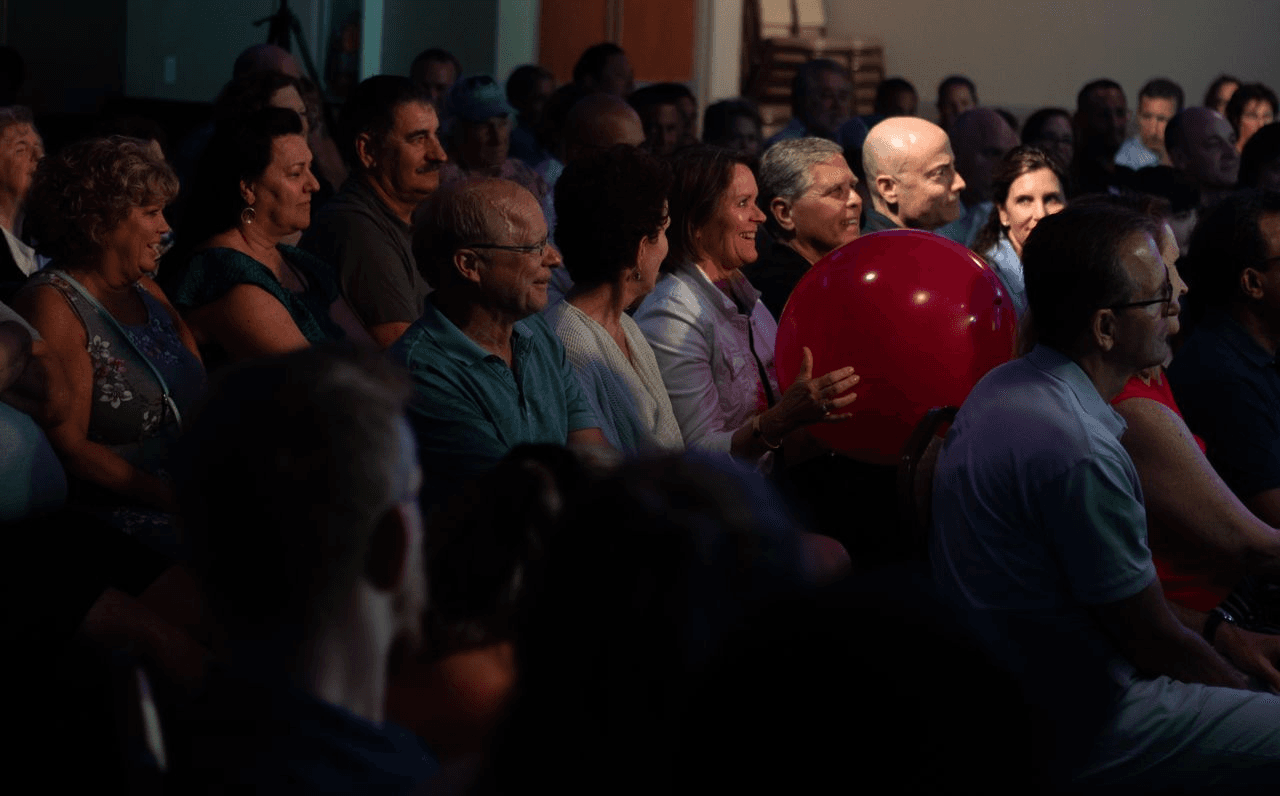Audience members reacting during the show