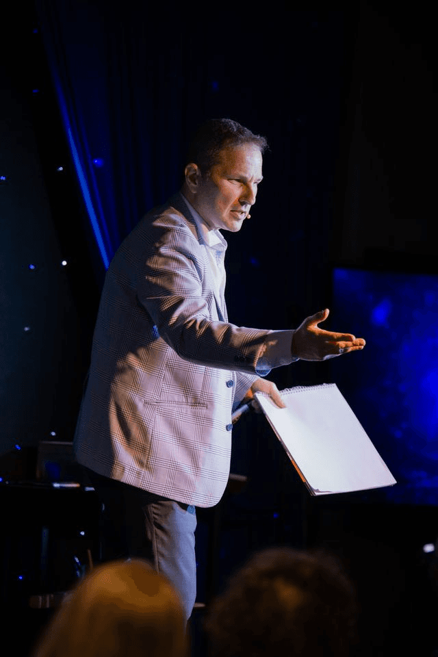 Guy Bavli presenting to a corporate audience